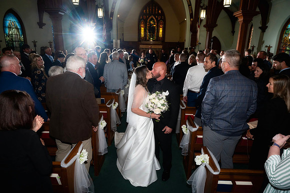 Church kiss wedding photo